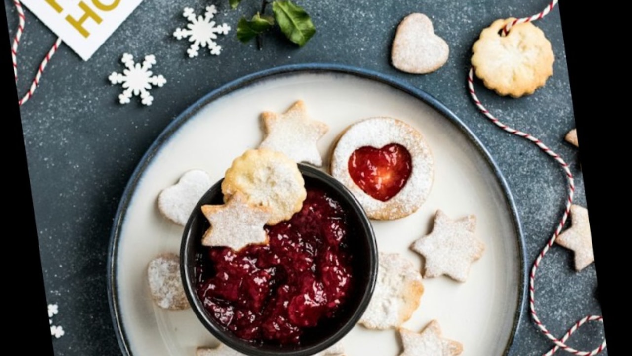 Cookies and cranberry sauce on a plate.